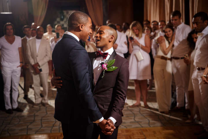 Evanston Gay Wedding photographer african american grooms have their first dance
