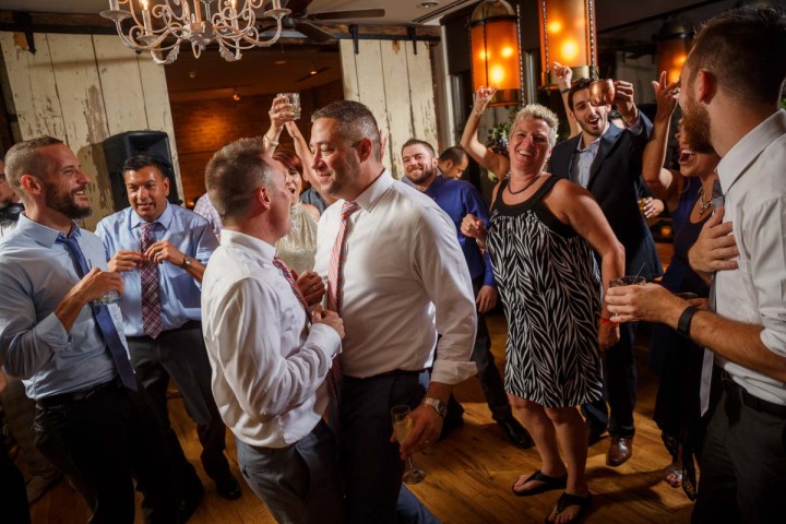 Evanston Gay Wedding Photography grooms dance together at the Farmhouse