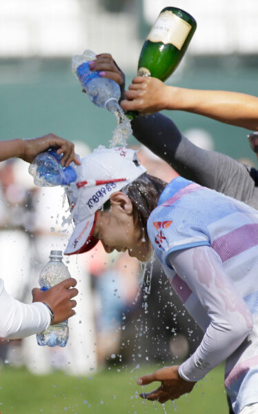 Na-Yeon Choi of South Korea is drenched in champagne and water by fellow golfers after winning the U.S. Women's Open golf tournament at Blackwolf Run in Kohler, Wisconsin July 8, 2012. REUTERS/John Gress