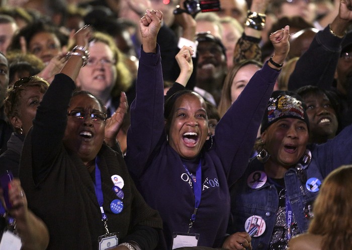 Supporters of U.S. President Barack Obama cheer during his election night rally in Chicago, November 6, 2012. REUTERS/John Gress
