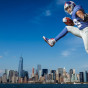 new york giants Paul Perkins poses for a portrait against the New York Skyline in this photo by Photographer John Gress