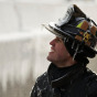 Chicago Firefighter Michael De Jesus is covered in ice as he mans a water cannon while fighting a warehouse fire January 24, 2013, which caught fire Tuesday night in Chicago. Fire Department officials said it is the biggest fire the department has had to battle in years. One-third of all Chicago firefighters were on the scene at one point or another trying to put out the flames. REUTERS/John Gress (UNITED STATES)