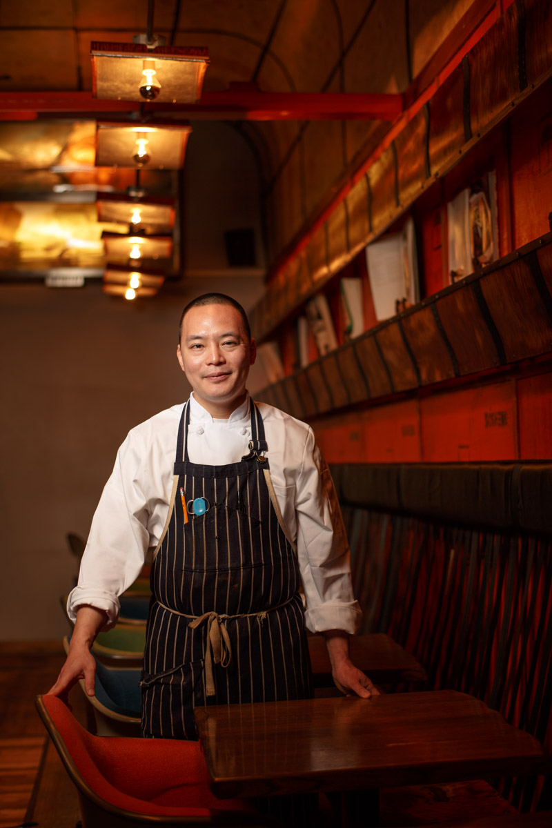 Chicago Magazine Photographer portrait Ruxbin Chef Edward Kim poses for a portrait in his Chicago dining room.