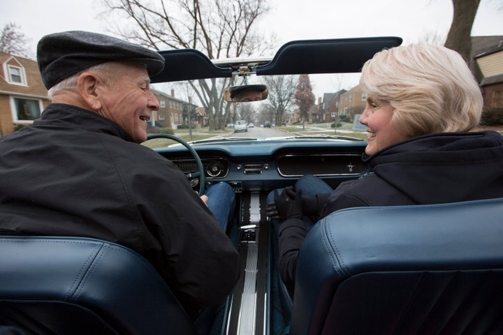 Tom and Gail Wise ride in her Skylight Blue 1964 1/2 Ford Mustang convertible in Park Ridge, Illinois November 26th, 2013. REUTERS/John Gress