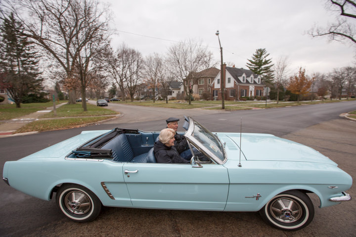 Tom and Gail Wise ride in her Skylight Blue 1964 1/2 Ford Mustang convertible in Park Ridge, Illinois November 26th, 2013. Gail Wise, then using her maiden name of Gail Brown, made the first known retail purchase of a Mustang on April 15, 1964, two days before the model went on sale. Ford will unveil its next-generation 2015 Mustang on December 5, 2013 for the model's 50th anniversary with simultaneous events in Michigan, Shanghai, Sydney, Barcelona, New York and Los Angeles. REUTERS/John Gress