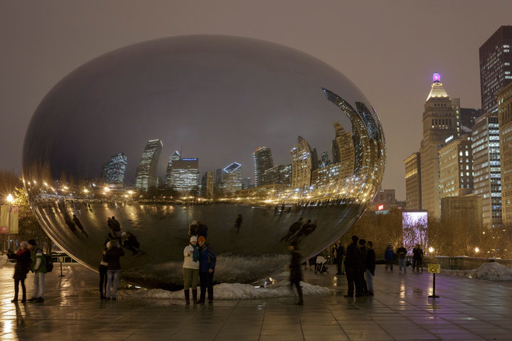 Chicago Magazine Photographer: Tourists visit the "Bean," or as its officially known, Cloud Gate, in Millennium Park.