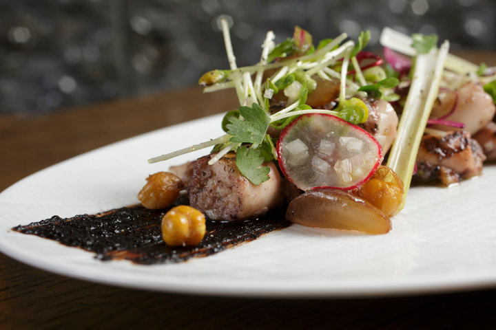 Grilled octopus appetizer with chickpeas, pickled green onions, black soybean, grapes and ginger-scallion vin ($12) is seen at Ruxbin by Chicago Magazine Photographer John Gress