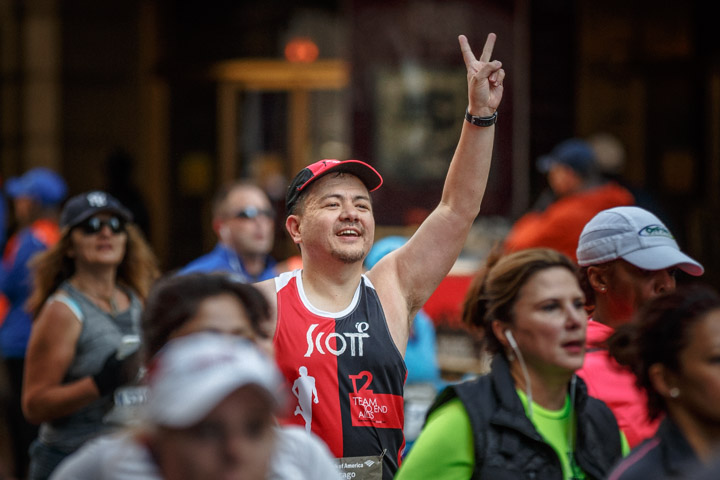 A sports photographer captures a runner during the Marathon in Chicago