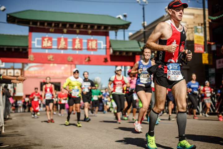 Runner make their way though Chinatown during the Chicago Marathon as captured by a professional Sports Photographer