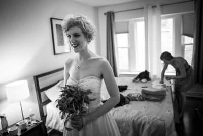 lesbian bride take last look in mirror before wedding