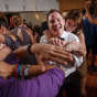 Illinois gay wedding photography of hug on the dance floor in Chicago