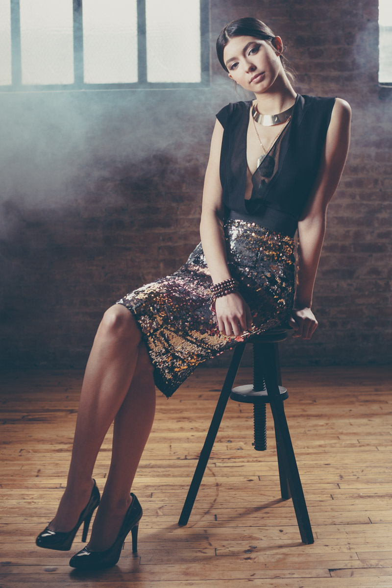 Chicago Fashion Photographer teen female model on stool in warehouse