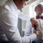 African American Gay Groom Gets readdy for wedding at Hilton Orrinton Hotel in Evanston Illinois