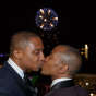 Evanston Gay Wedding photographer african american grooms kiss during fireworks display