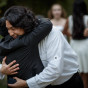 Bride hugs son by Chicago Suburbs Lesbian Wedding Photographer