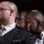 Chicago Gay Wedding Photographer captures grooms listening to the pastor during their ceremony