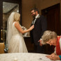 Chicago wedding photographer at union league club pastor signs marriage liscens