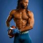Fitness modeling in Chicago shirtless football portrait