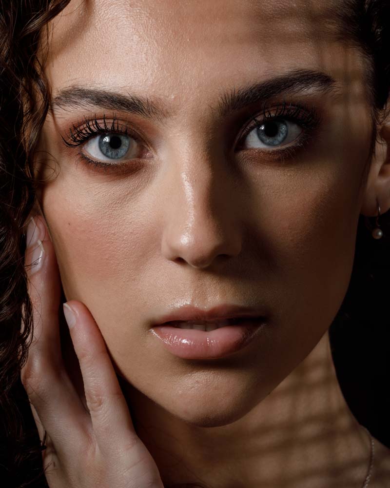 female model headshot with dramatic lighting 