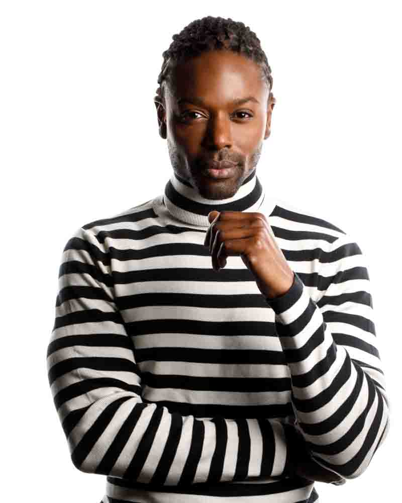Christopher in a striped turtleneck sweater