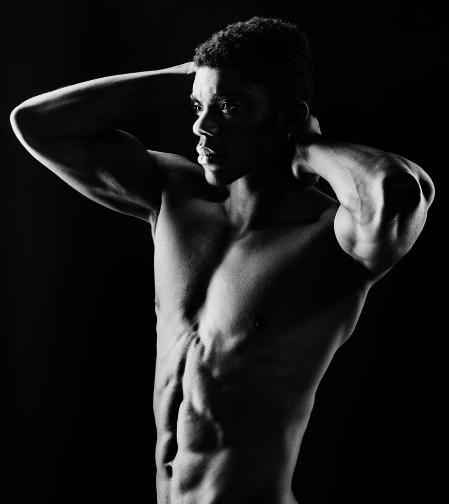 Nicholas's muscular definition in black and white