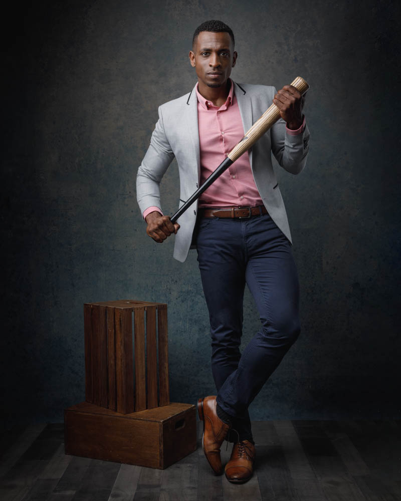 Chicago based photographers capture Teagan in action mode, dressed as a baseball player, highlighting versatility in fitness modeling