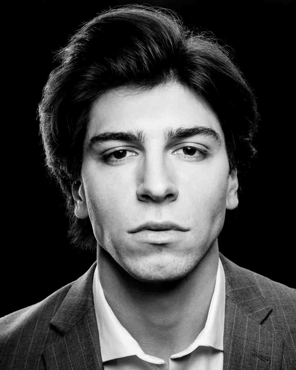 Noah in a dramatic black and white setting, emphasizing strong character portrayal thanks to a Chicago headshot photographer
