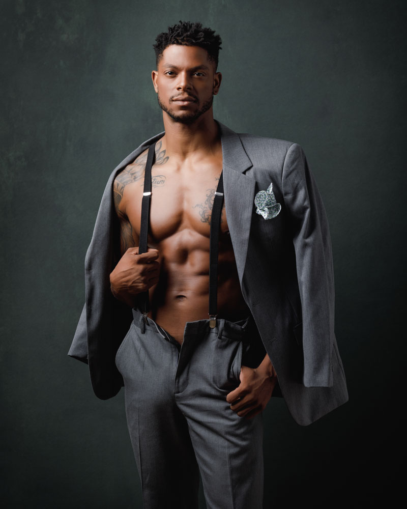 Male model Jasonn in a stylish gray suit and suspenders