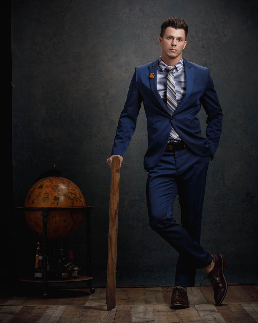 Model Kenny posing in a stylish blue suit for a model portfolio in Chicago, exemplifying professional attire and pose