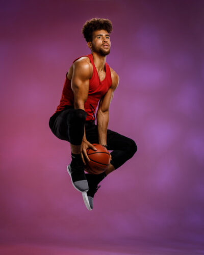Action shot of Trae playing basketball, fitness model headshots Chicago