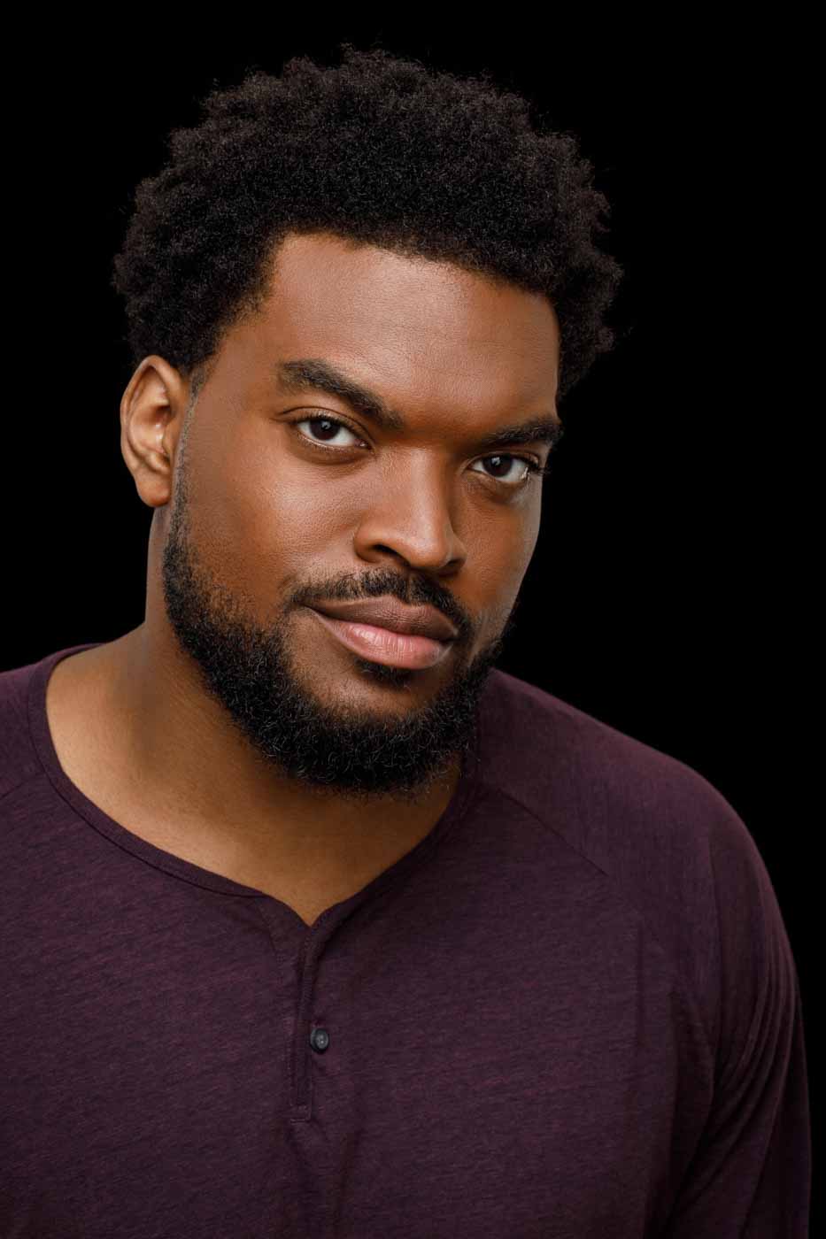 Classic headshot of big and tall actor Mark W. in a maroon shirt, a staple for casting calls in Chicago