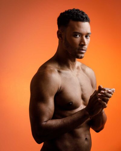 Fitness model Zane shirtless for a headshot in Chicago, showcasing professional grooming and styling ideal for fitness modeling