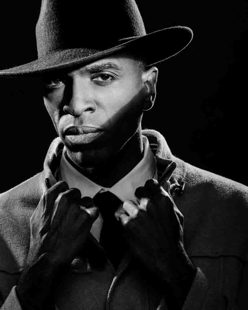 Dramatic black and white headshot of Ken