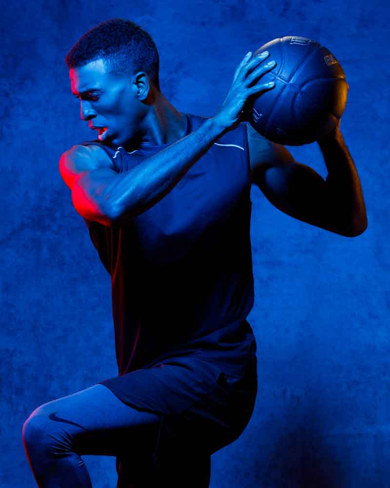 Dynamic use of color gels in Ken's athletic-themed modeling photo shoot.