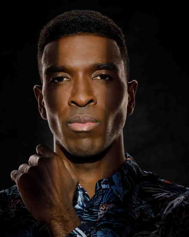 Dramatic headshot of Ken with lighting from below