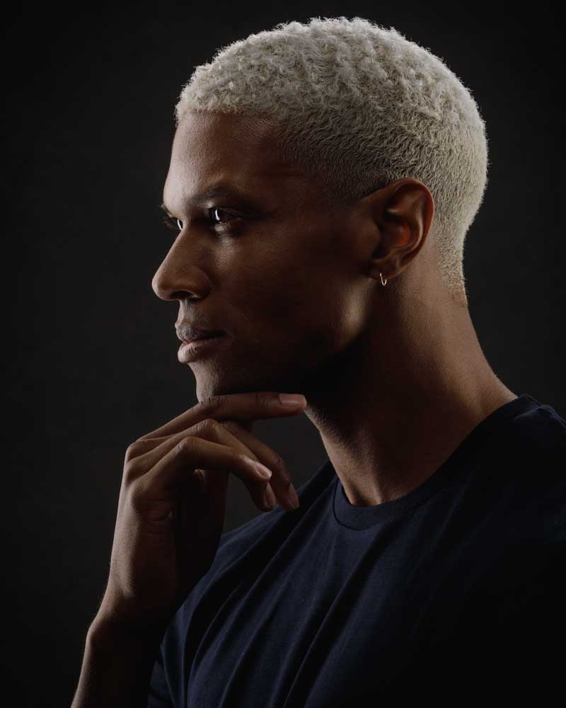 Dynamic lighting emphasizes Jaquez's strong profile, blending perfectly with the studio setting