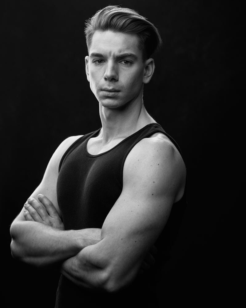 Chicago modeling portfolio photographer's Black and white portrait of Erik, emphasizing his muscular build and modeling versatility