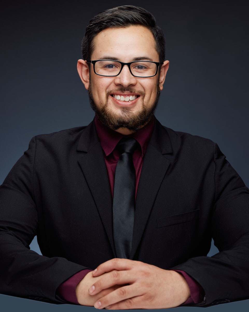 Baudello presenting a professional and approachable demeanor in his headshots.