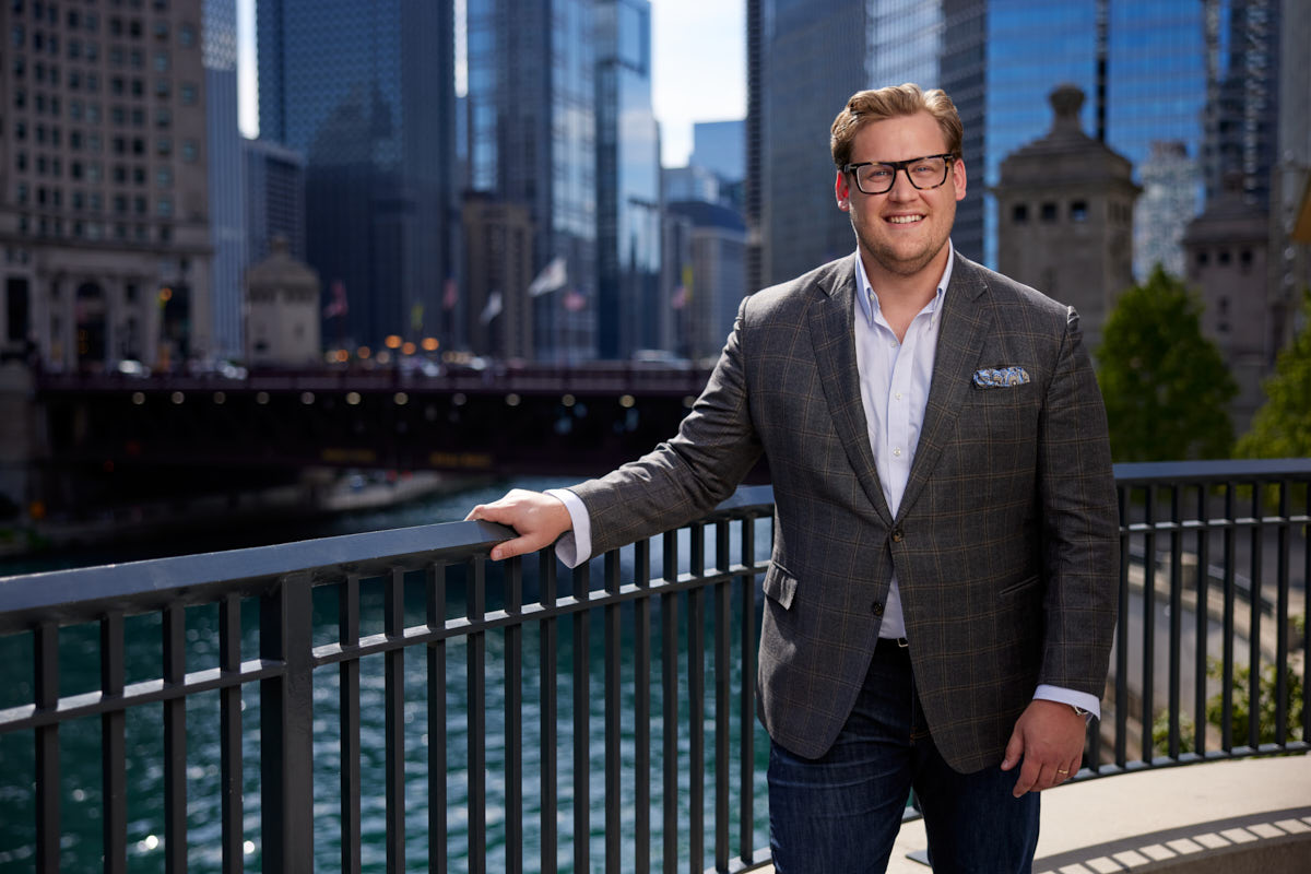 Evan from the reviews, confidently posing in his professional Chicago realtor headshots.