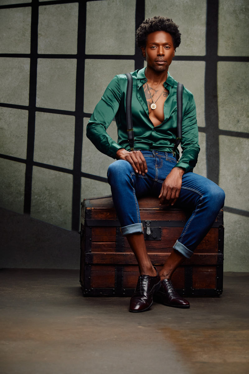 Chris on a vintage chest with bold fashion photography styling by John Gress in Chicago.