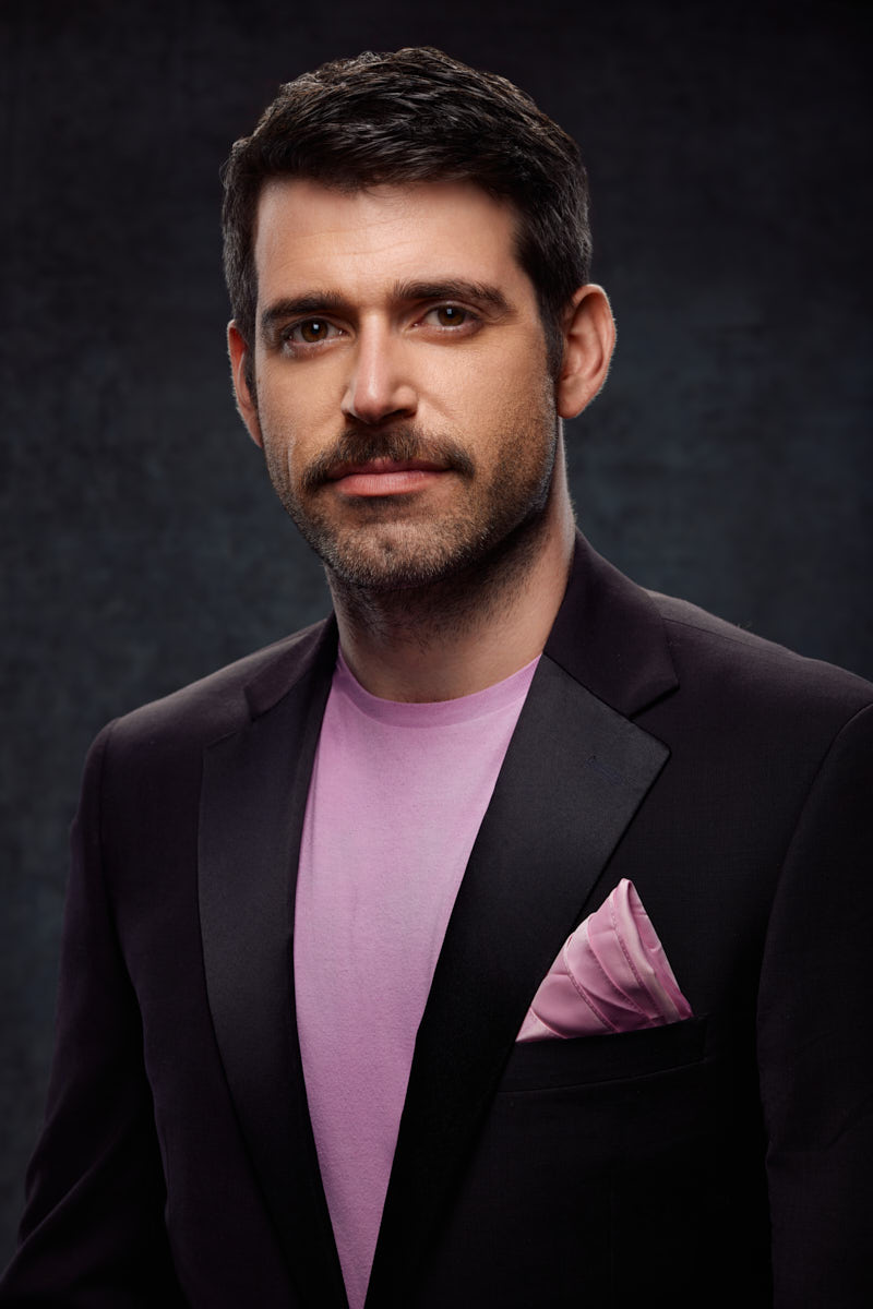 Male model in a formal suit preparing for an audition in Chicago.