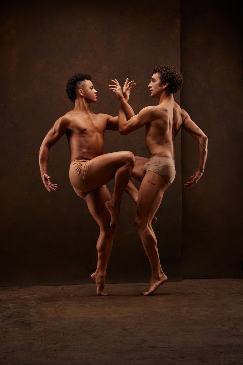 João and Edson poised in a striking dance pose, captured during their professional dancer headshots session in Chicago.
