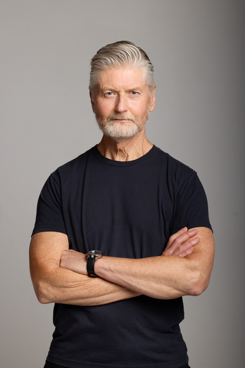 Arms crossed portrait of Jeff, confident expression.