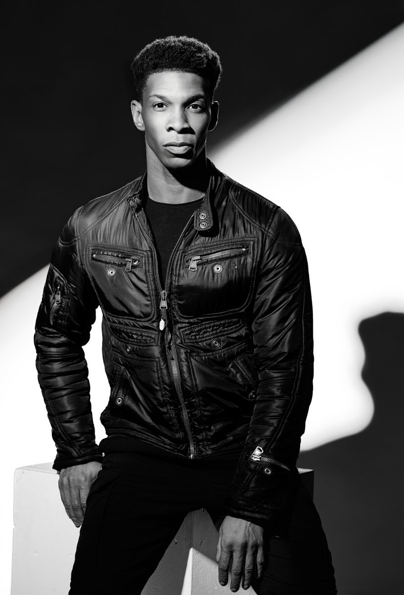Black and white dancer portrait Chicago leather jacket dramatic lighting