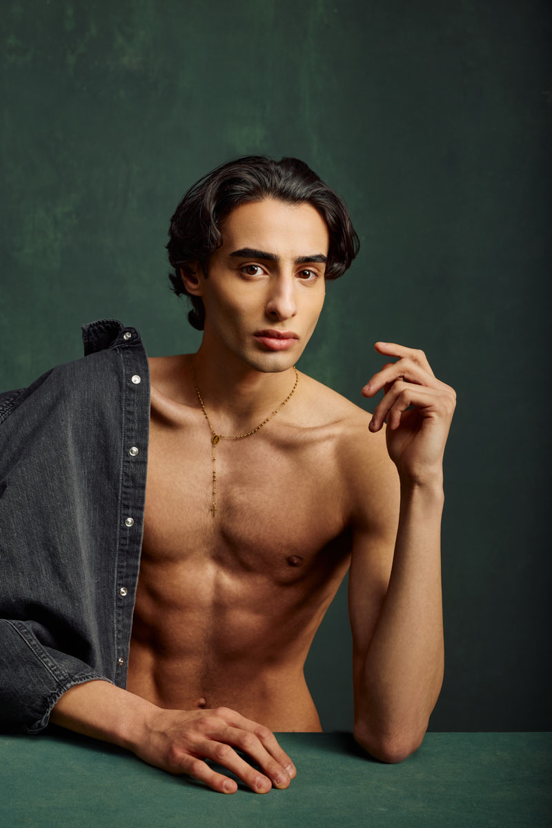 Close-up portrait of Giorgio with a denim jacket over one shoulder for a Male Fashion model portfolio Chicago.