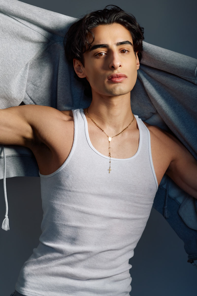 Editorial close-up of Giorgio wearing a white tank top beneath a hoodie for a Male Fashion model portfolio Chicago.
