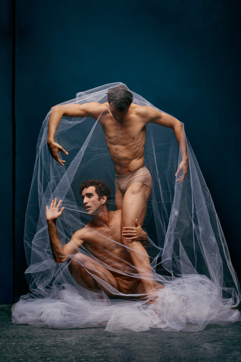 Dancers grounded in a dramatic moment at a stylized dance photography studio in Chicago