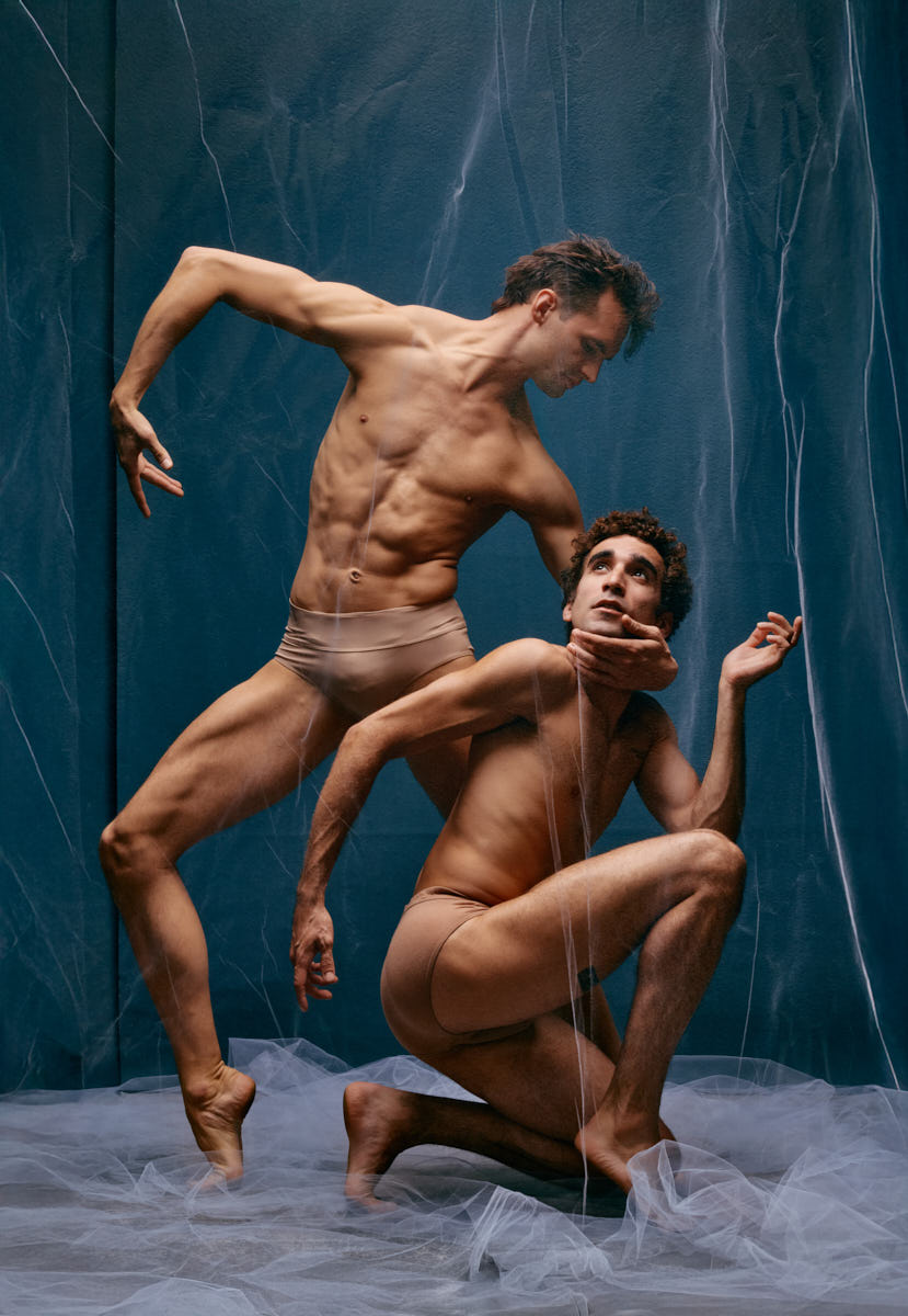 Two dancers wrapped in tulle during stylized Chicago studio session